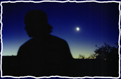 Jarod before a quarter moon in sycamore canyon in Northern Arizona just outside of Cornville