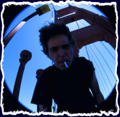 Chris before one of the towers that hold up the Golden Gate Bridge in San Francisco - Summer 2001 - Chris Gabrielsen Photography