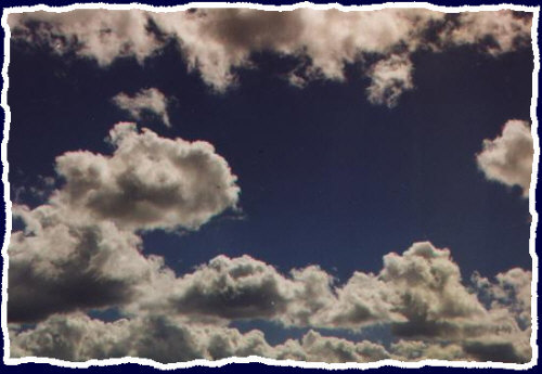 A cool shot of some clouds above Secrist Hall at Northern Arizona University in Spring 1999