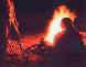 Profile of a friend in front of a fire while camping