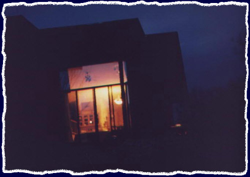 This is the full moon rising in the background causing a killer sillohuette of the house